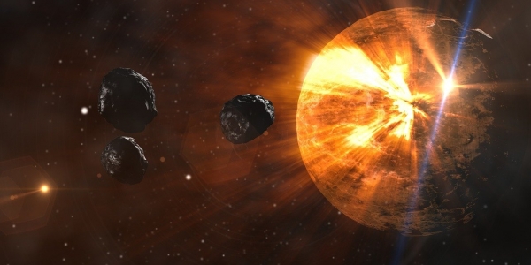 Imagen de asteroides acercándose a una estrella. 